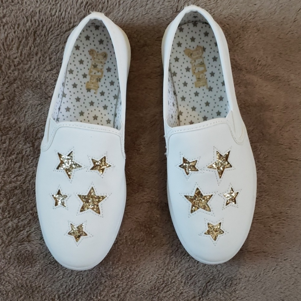Girl's white slip on with gold glitter stars. Y4